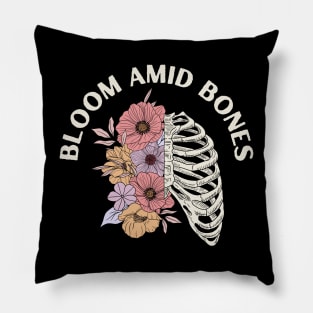 Bloom Amid Bones, skeleton chest, flowers Pillow