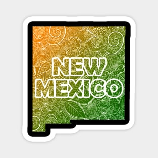 Colorful mandala art map of New Mexico with text in green and orange Magnet