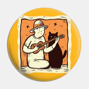 Guy plays guitar for a cat Pin