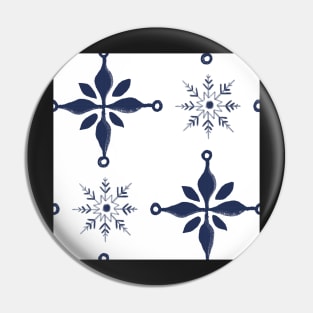 Pattern of blue snow crystals and crosses on white Pin