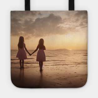 Two girl waits at sea holding hands Tote