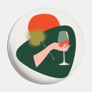 Abstract hand with a glass of wine and leaf Pin