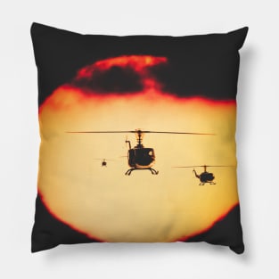 Bell Huey helicopters flying in front of the setting sun Pillow