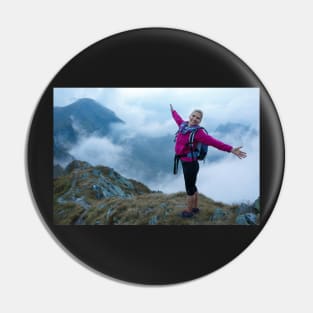 Woman backpacker hiking on a trail Pin