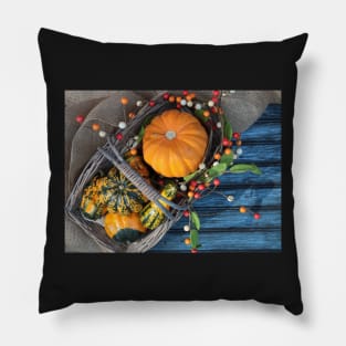 A basket of pumpkins in the fall season with fall decoration. Pillow