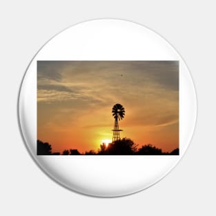 Kansas colorful Sunset with a Windmill silhouette and a bird in the sky. Pin