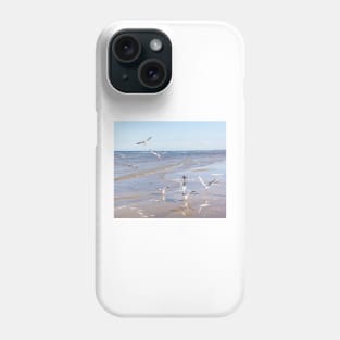 Flock of seagulls flying above the water Phone Case