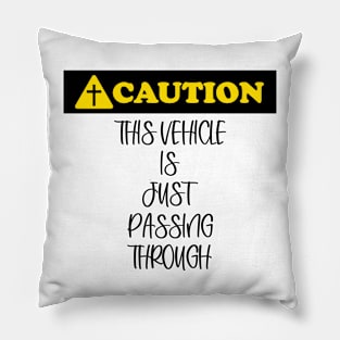 Caution: This vehicle is just passing through (black letters). Pillow