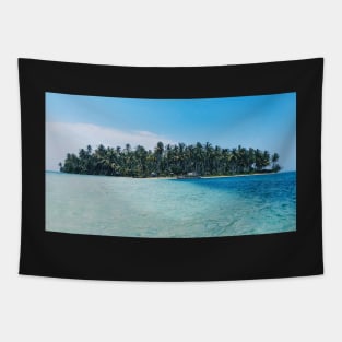 Distant view of a boat moored at an island covered with tropical trees Tapestry