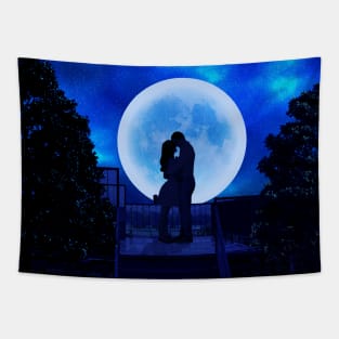 A boy and a girl are standing and making love in the moonlight. Tapestry