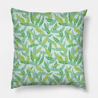 Green tropical plant leaves on light blue background Pillow