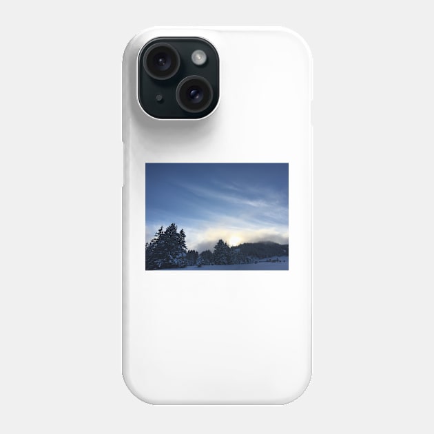 Sunset over a snow covered mountain Phone Case by Dturner29