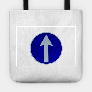 Rounded traffic sign in blue and white, ahead only Tote