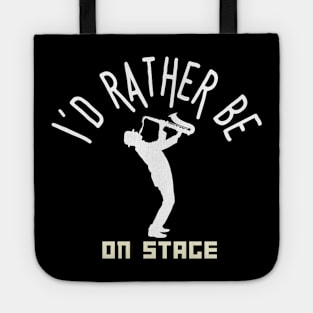 I´d rather be on music stage, saxophonist. White text and image Tote