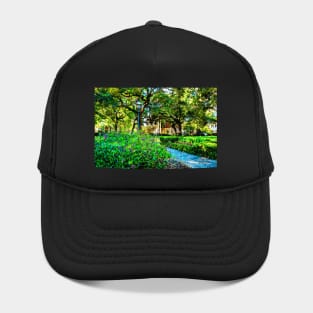 Watercolor painting of a Greene Square in Savannah, Georgia with lush greenery Hat