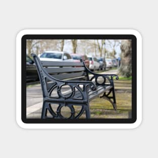 Bench for people to sit along the Thames river embankment in Windsor, Berkshire, England, UK Magnet