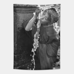 Girl Drinking water in Peru Tapestry