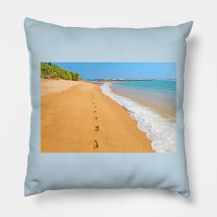 Footprints on sunny beach by emerald sea Pillow
