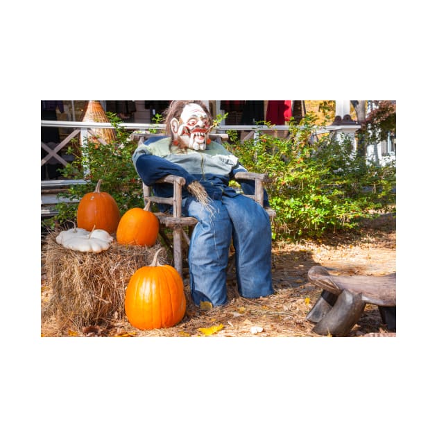 Halloween Mannequin in with ugly mask chair outside beside three large orange pumpkins by brians101