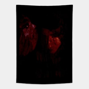 Portrait, collage, special processing. Man, dark costume, long hair, looking down. On left demon of gold. Red. Tapestry