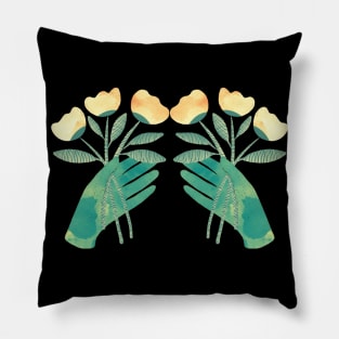 Green hands with yellow flowers for you on black background Pillow