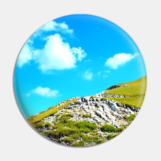 View from Sassotetto at a Sibillini slope with rocks and vegetation under the sky Pin