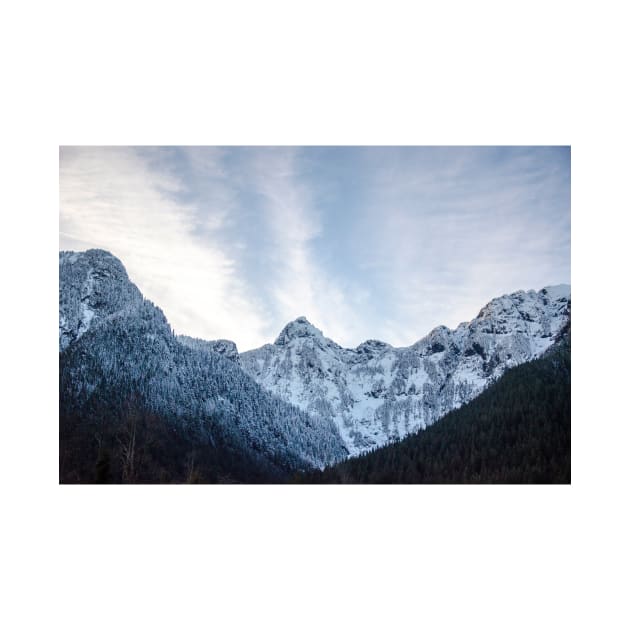 Blue Winter Sky Framed By Snowy Mountains by pmcmanndesign