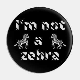 I'm not a zebra. White letters with a mask in the shape of diagonal stripes and two black and white zebras Pin