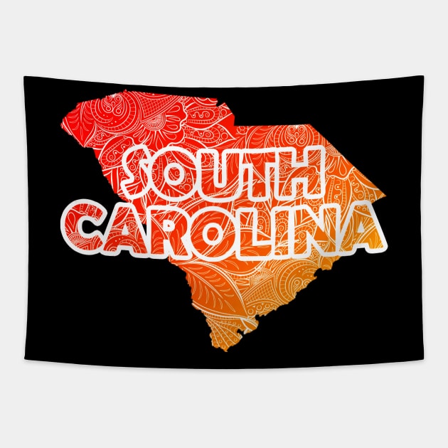 Colorful mandala art map of South Carolina with text in red and orange Tapestry by Happy Citizen