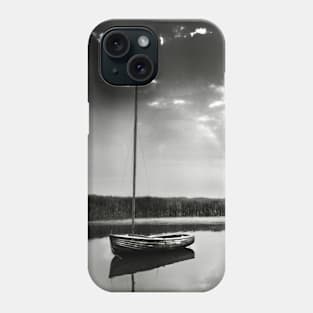 A moored yacht in calm waters at Brancaster Staithe, Norfolk, UK Phone Case