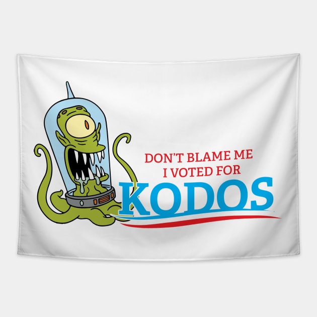 A 'Don't Blame Me I Voted For Kodos' design on a tapestry from TeePublic, showcasing the iconic alien from The Simpsons.
