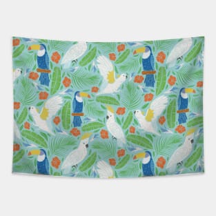 Blue toucan with white cockatoo amoung tropical flowers and leaves Tapestry