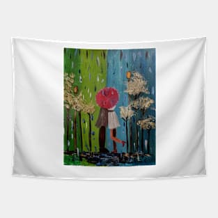 A couple having a kiss in the rain under the umbrella in a park Tapestry