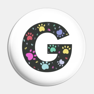 G letter  with colorful paw print Pin