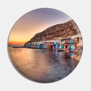 Sunset at the fishermen houses with the impressive boat shelters, also known as “syrmata” in Klima of Milos, Greece Pin