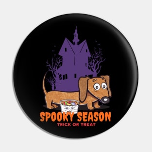 Funny and cute haunted house Doxie Dachshund during spooky season with scary house and trees Pin