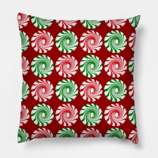 Peppermint swirl candy on red Pillow