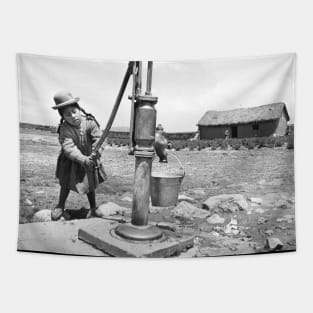 Girl Pumping water in Puno Peru Tapestry