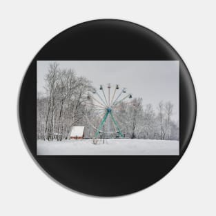 Old observation wheel in the snowy park Pin