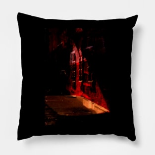 Special processing. Person walking at night, on dark street, with stone walls. Bright Red. Pillow