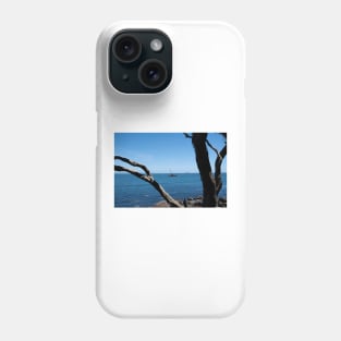 View through twisted pohutukawa tree branches across barge with crane blue ocean to distant horizon Phone Case