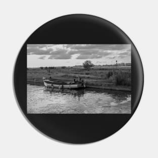 Wooden boat moored in Thurne Dyke in the Norfolk Broads National Park Pin