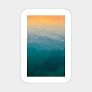 Relaxing ocean surface with sunset colors Magnet