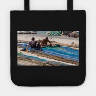 Mending fishing nets. Tote