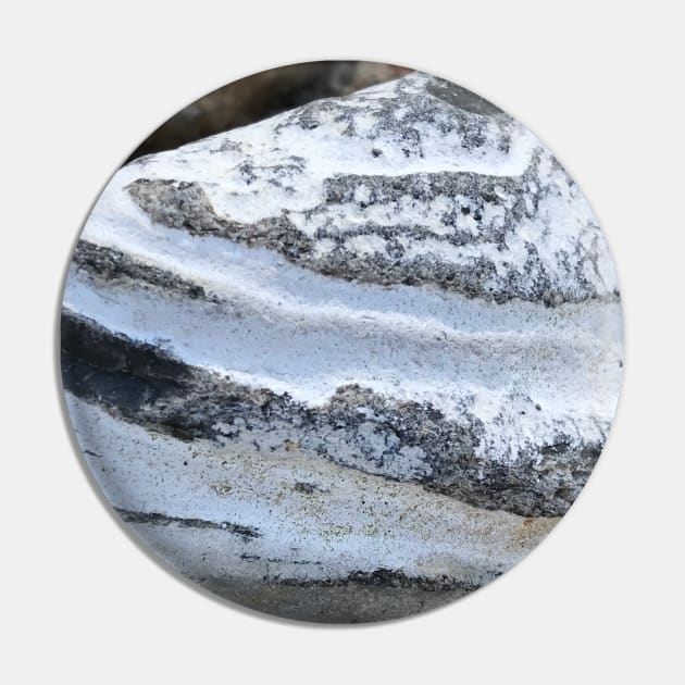 Close-up of beautiful layered triangular stone rock in white and grey stripes Pin by Khala