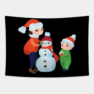 Kids building snowman Tapestry