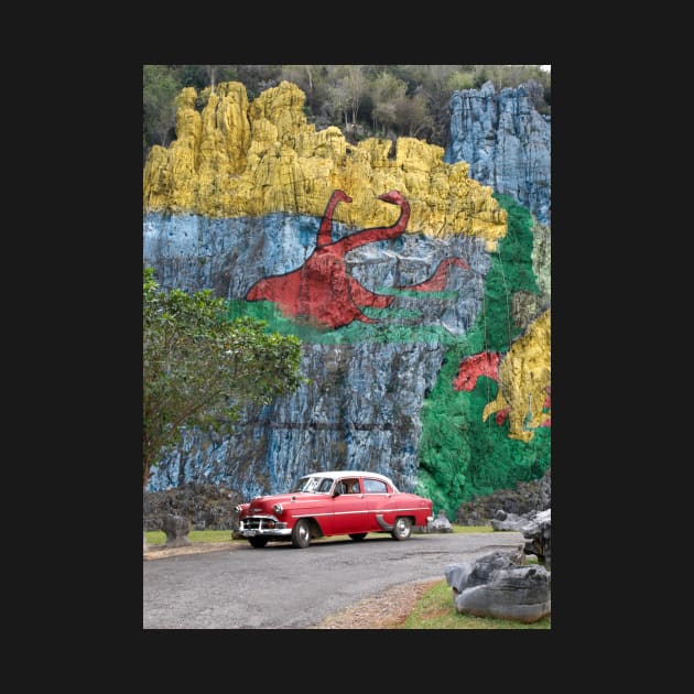 Vintage cars in front of the Mural de la Prehistoria in Cuba by Offiinhoki