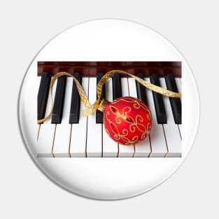 Christmas ornament on piano keys Pin