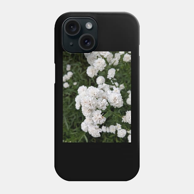 Small white flowers in gardenbed Phone Case by topsnthings