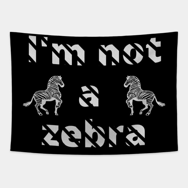 I'm not a zebra. White letters with a mask in the shape of diagonal stripes and two black and white zebras Tapestry by PopArtyParty
